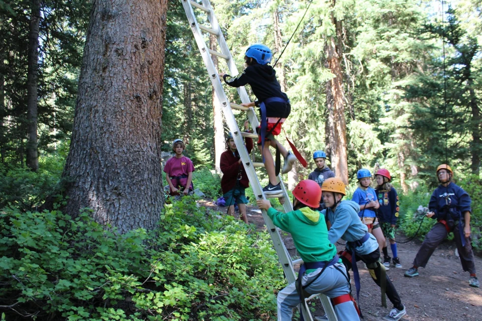 Group climbing effort at Camp Tuttle