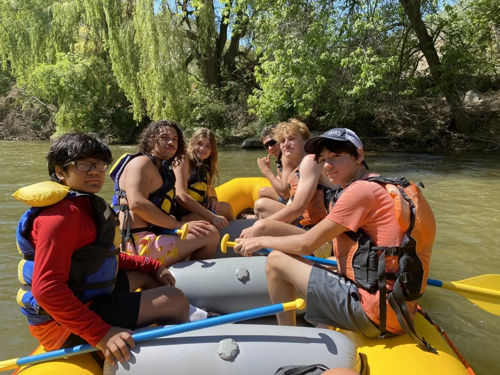 Group of attendees rafting at Camp Tuttle